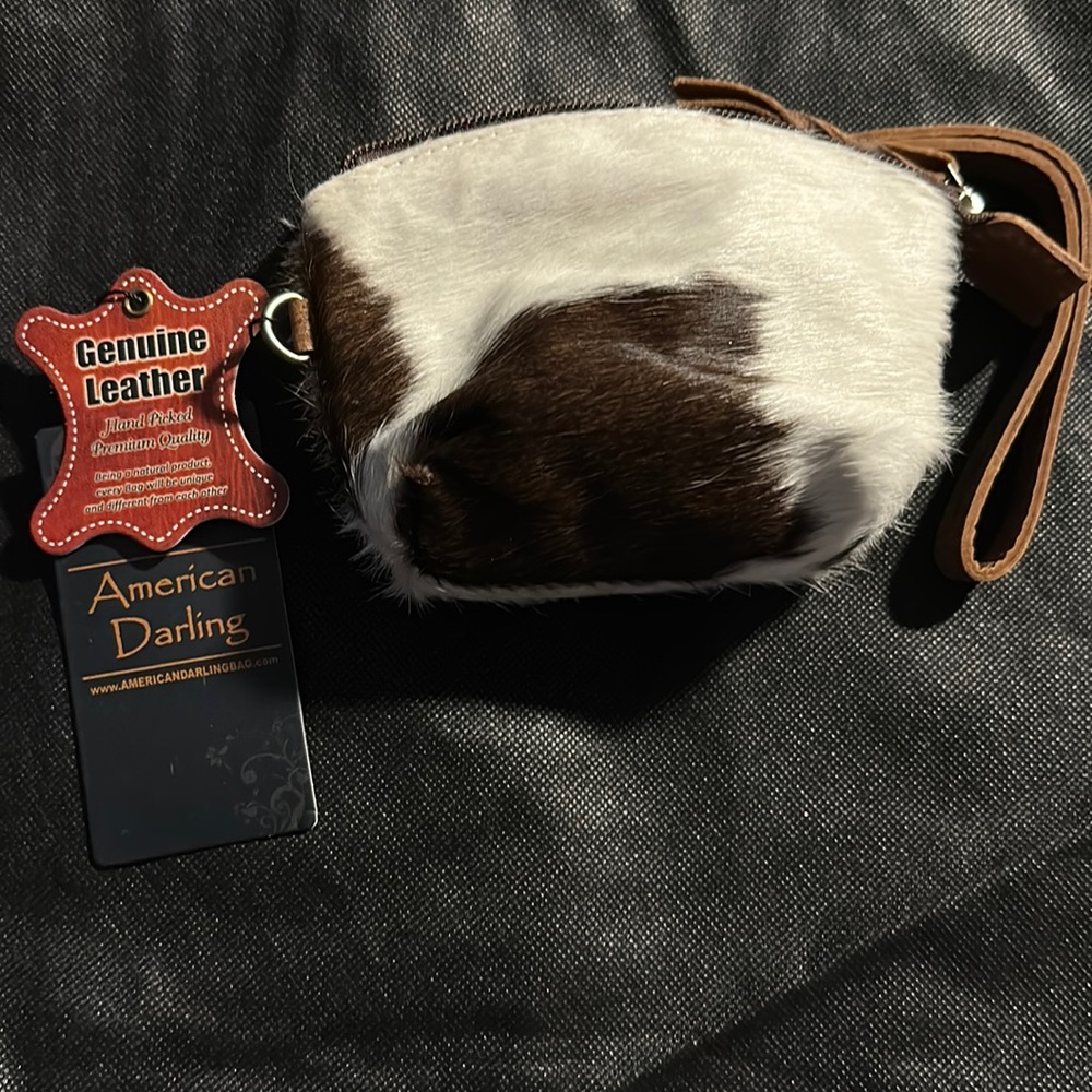 Small coin purse with wristlet strap